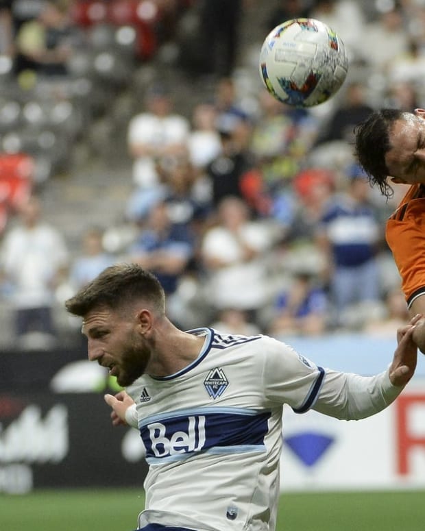 Aug 5, 2022; Vancouver, British Columbia, CAN; Houston Dynamo FC forward Sebastian Ferreira (9) goes up for a header against Vancouver Whitecaps FC defender Tristan Blackmon (6) during the second half at BC Place. Mandatory Credit: Anne-Marie Sorvin-USA TODAY Sports